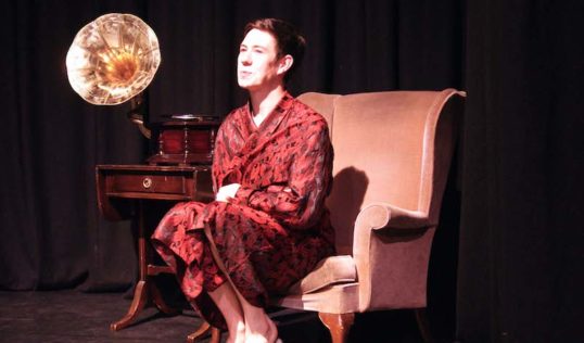 Andrew Strling (Man in Chair) in the Edinburgh University Savoy Opera Group's production of the Drowsy Chaperone. Edinburgh Fringe 2012. Photo credit: Eusog