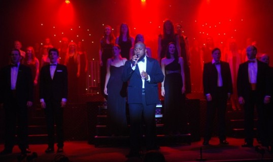 Ibiyemi Osinaike leads the chorus in Fix You for the finale of Showcase 2013: Musical Diversity. Photo: Mark Cassidy
