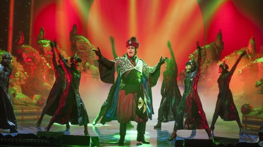 Abanazar (Grant Stott) with dancers. Photo: Douglas Robertson