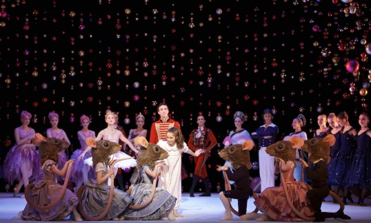 Robyn McKie as Clara, Sophie Martin as the Sugar Plum Fairy, Erik Cavallari as the Nutcracker Prince and Company members in Peter Darrell’s The Nutcracker. Photo by Andy Ross