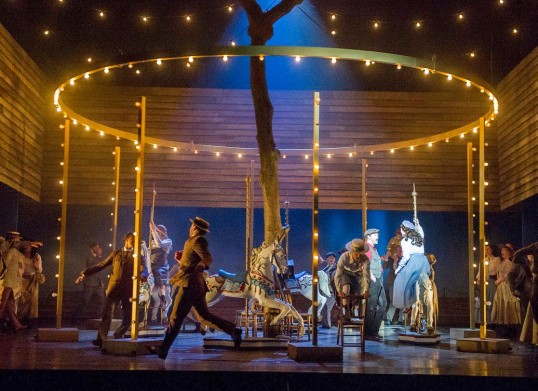 Keith Higham as Billy Bigelow and Gillene Butterfield as Julie Jordan (right) with the chorus and dancers Photo: Alastair Muir