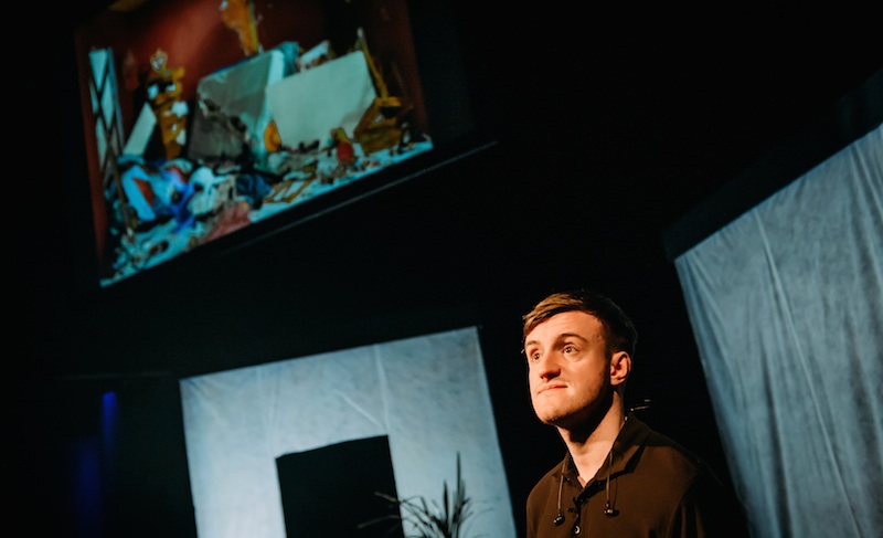 Video operator with image of Jeff Wall's photo behind. Photo Mihaela Bodlovic