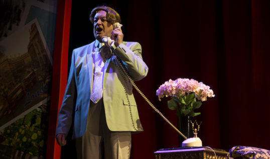 Bobby Crush as Jerry taking a phone call in Summer Holiday