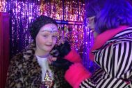 Orlaith, being painted with Ozian rhunes by Devine in exchange for bricks