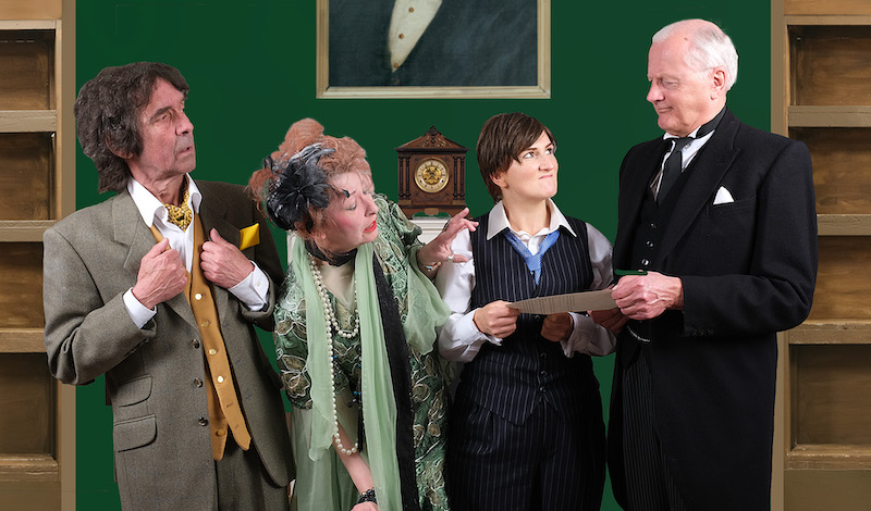 Four cast members of EPT's A Tomb With A View stand in line in costume.