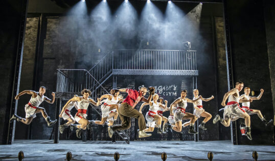 Performers dancing on the set of Bugsy Malone. 